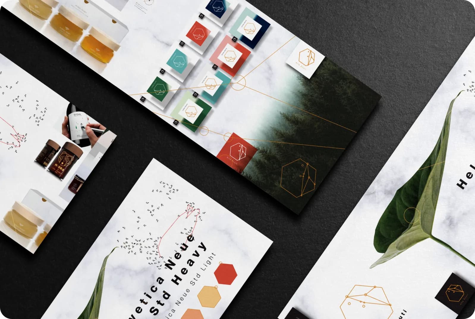 Castania brand collateral and graphic standard laid out on a dark desk.
