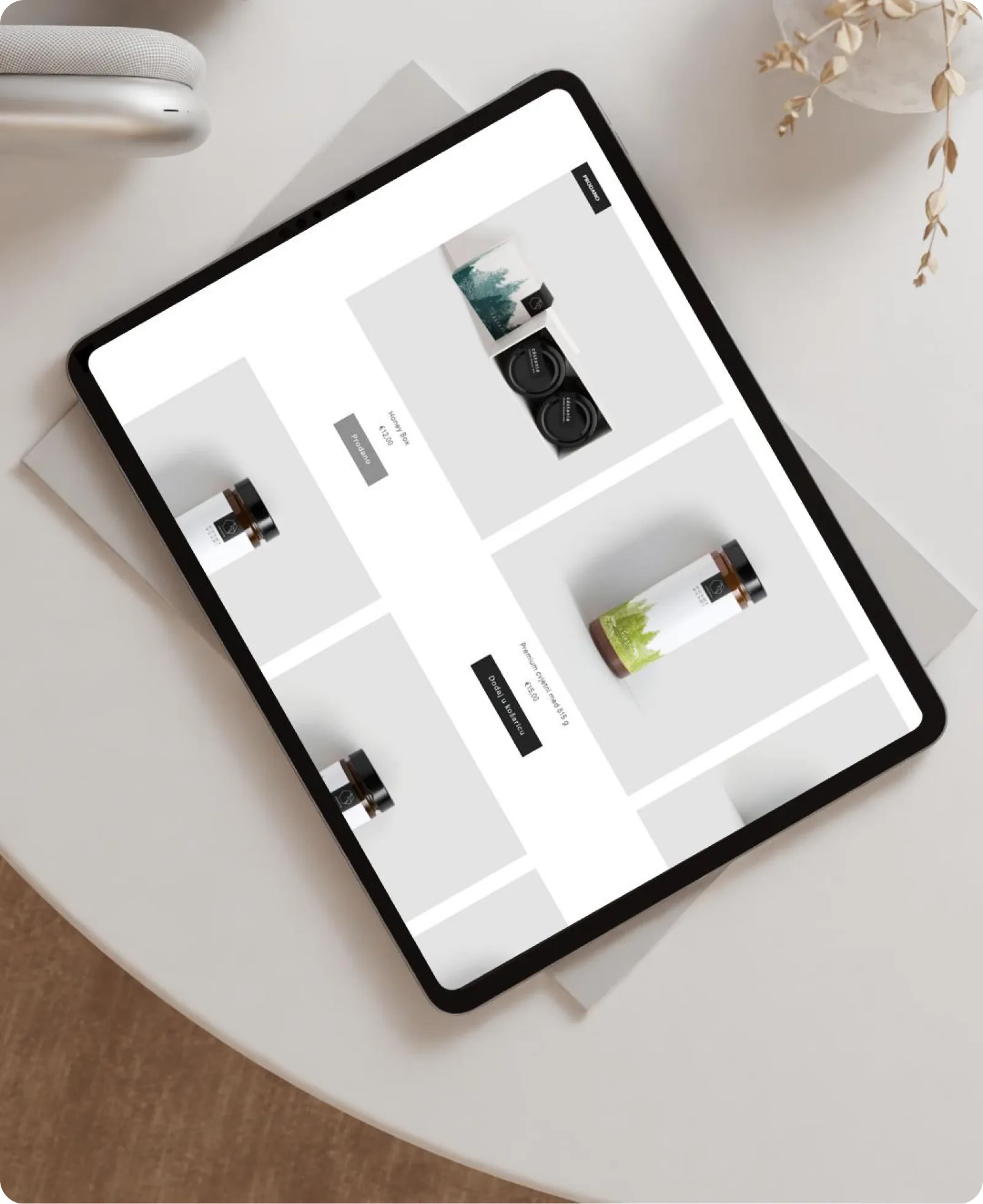 The Castania website shown on a tablet resting on a table.